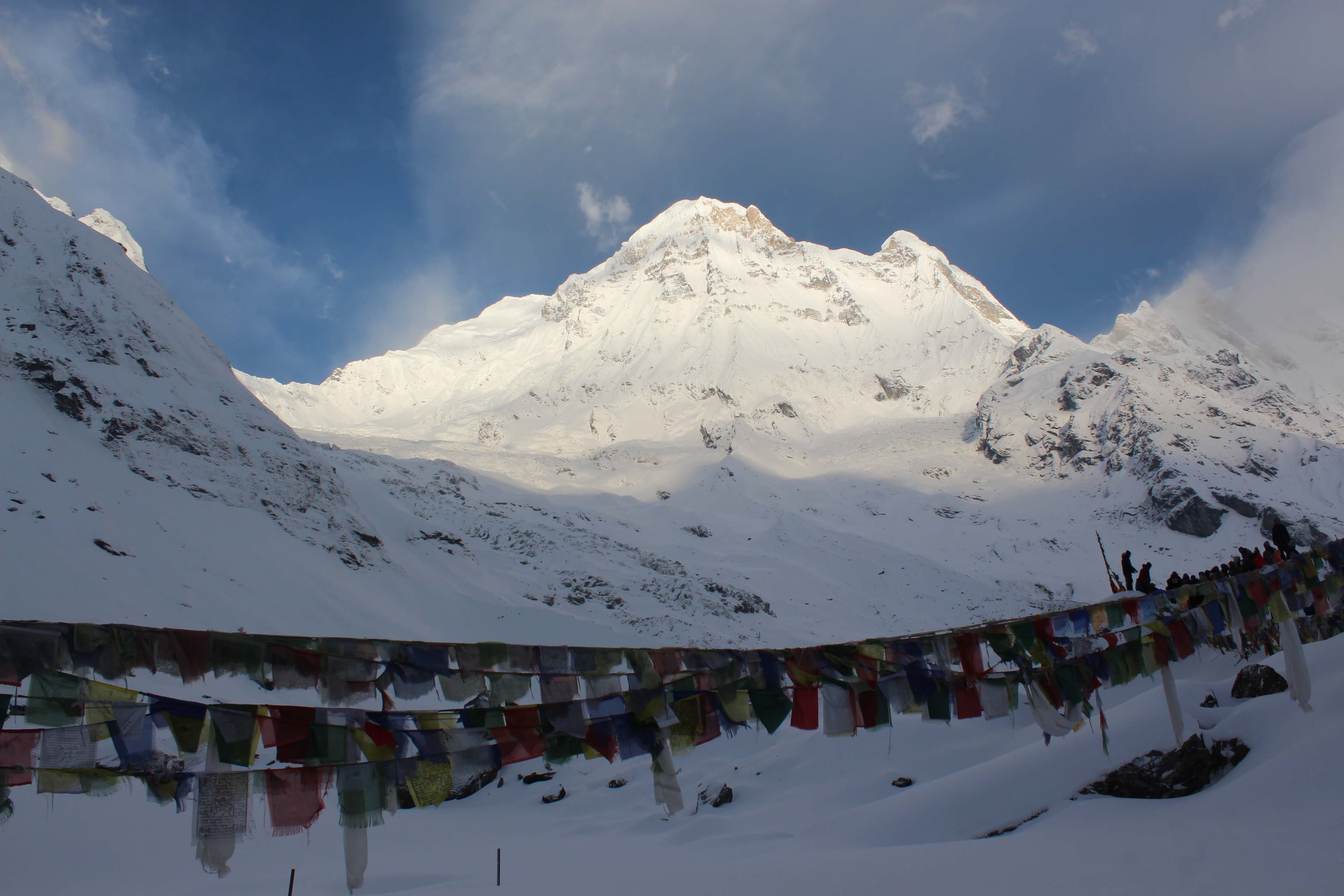 Beauty of Mt. Kanchenjunga in kanchenjunga region with tibetian flag on the kanchenjunga treks trail