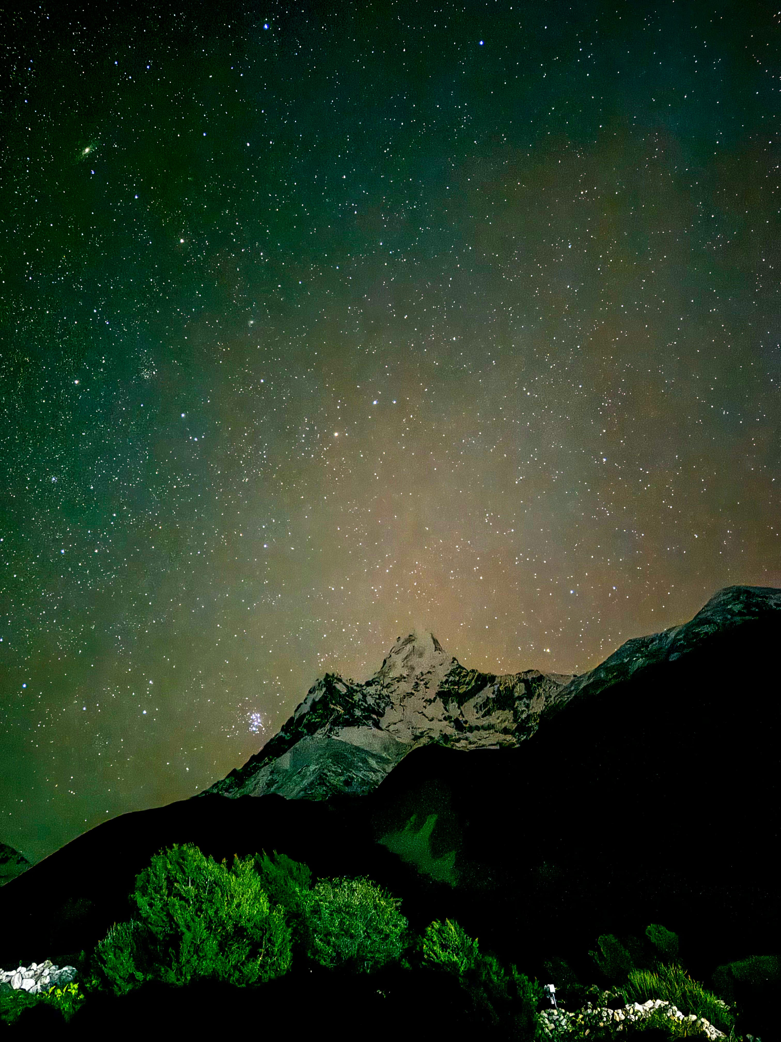 Night view of the mountains in the Everest Region, with the peaks illuminated by starlight, creating a serene and magical atmosphere in the heart of the Himalayas.