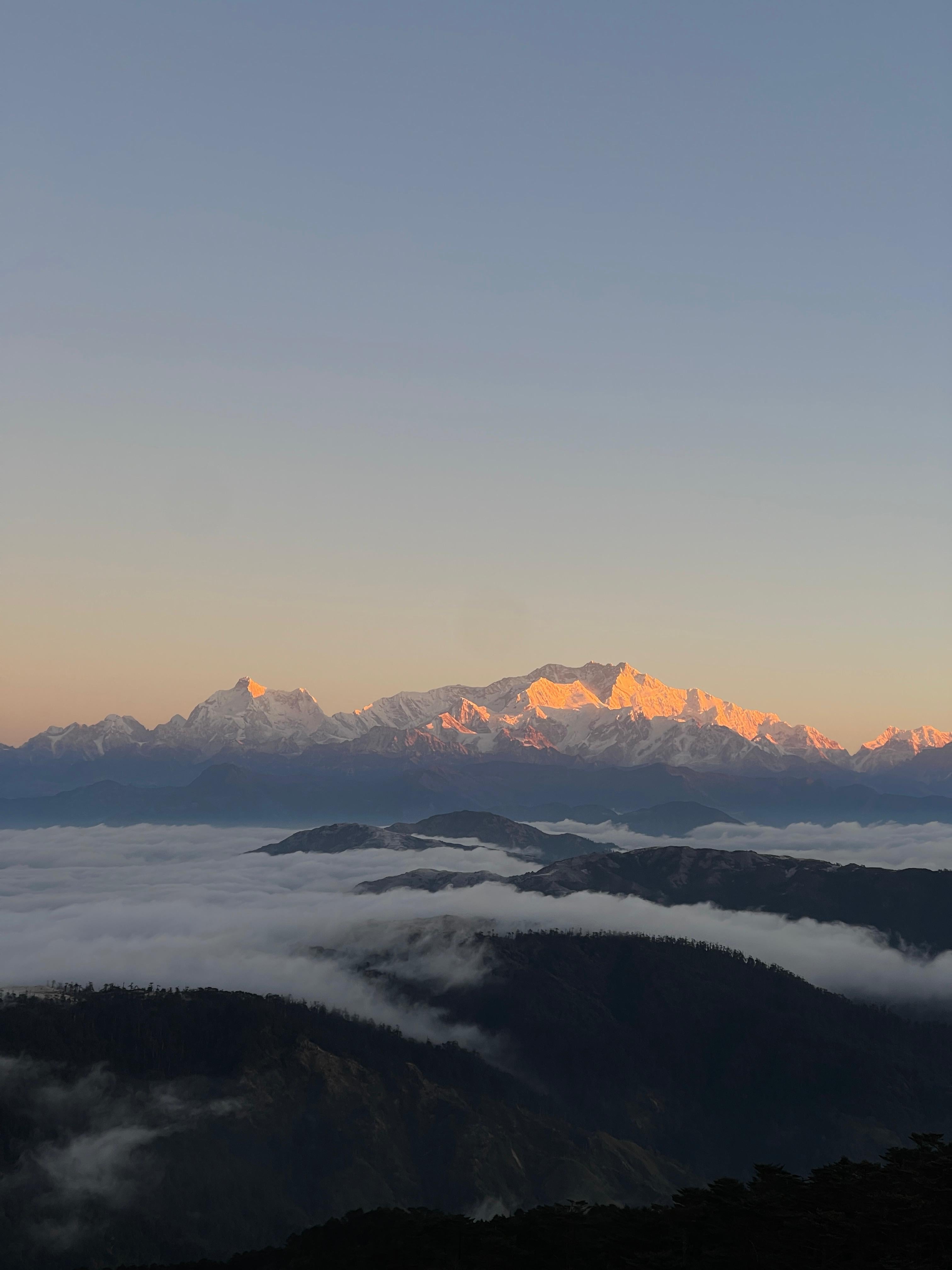 A breathtaking aerial view of Sandakpur, Ilam beneath the clouds in the Kanchenjunga Region, a must-visit destination for trekkers exploring Eastern Nepal.