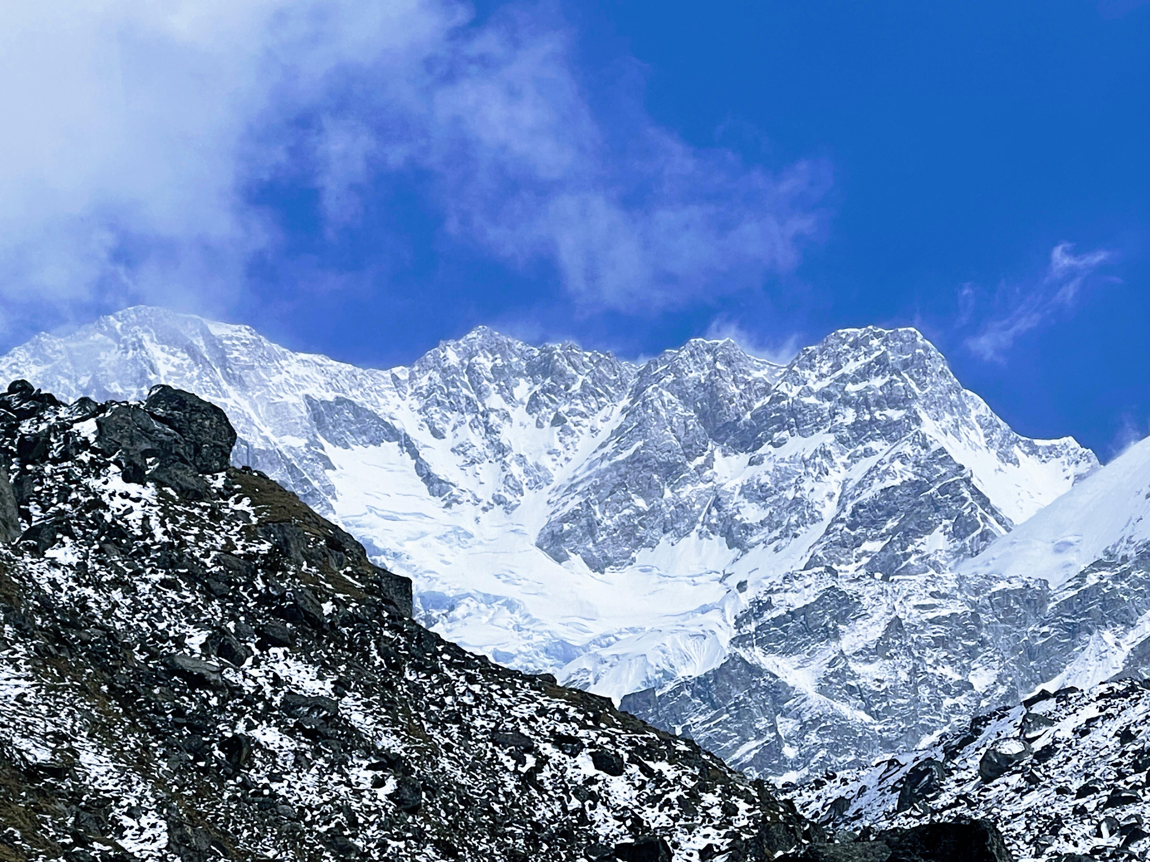 Dark gray mountain peaks in the Kanchenjunga Region, showcasing the region's raw, natural beauty—a perfect backdrop for trekking adventures in Eastern Nepal.