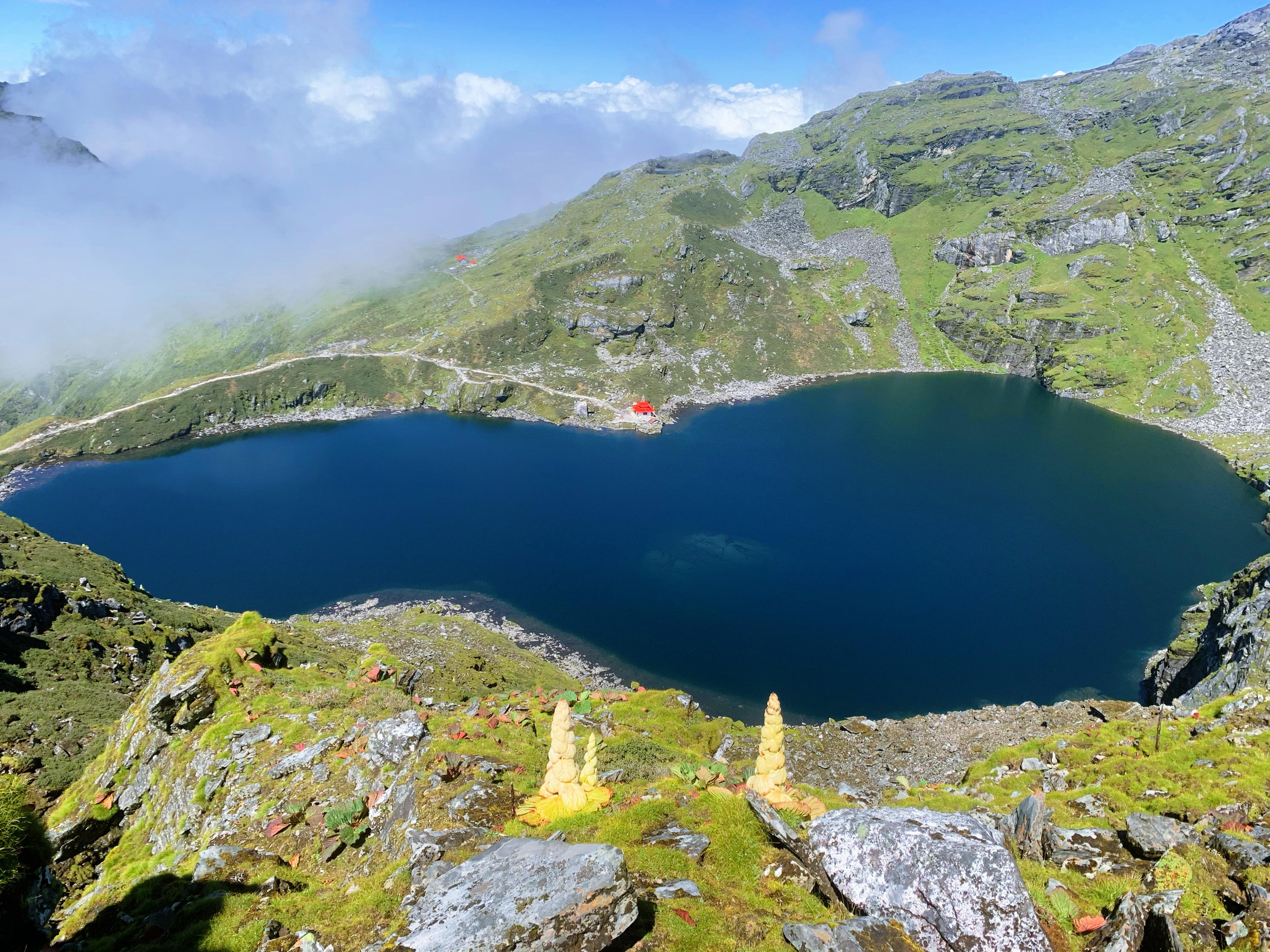 imbung Pokhari pond in the Kanchenjunga Region, reflecting the serene beauty of the surrounding mountains and landscapes, a hidden gem for trekkers in Eastern Nepal.